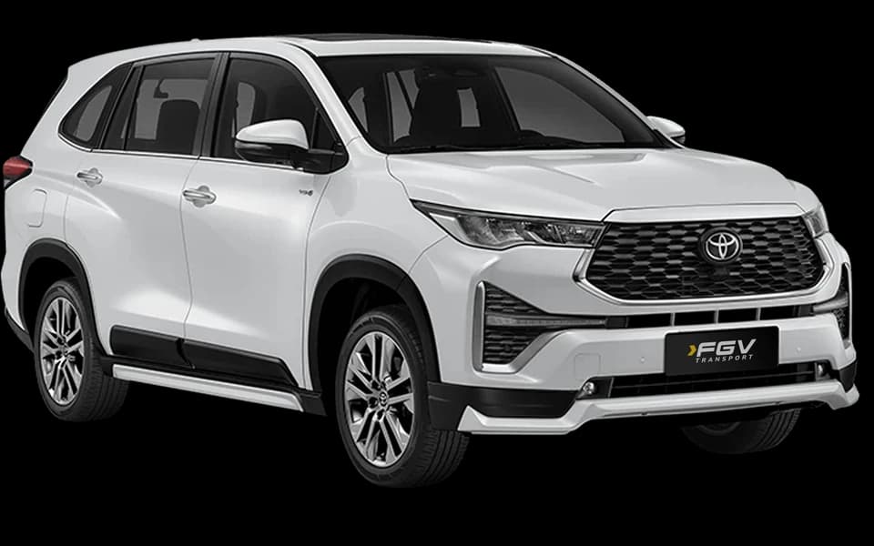 White Toyota Innova Zenix HEV, shown at a front three-quarter angle facing right.