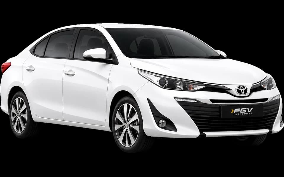 White Toyota Vios sedan, shown at a front three-quarter angle facing right.